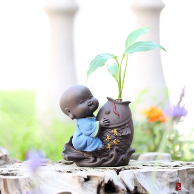 Tượng chú tiểu cưỡi cá chép - trồng cây, cắm hoa để bàn 